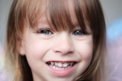 Close-up portrait of smiling girl