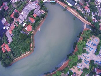 High angle view of river in town against sky