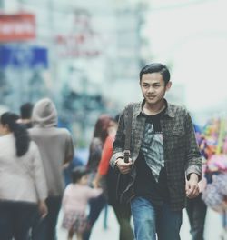 Teenage boy walking in city