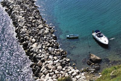 High angle view of rocks at sea shore