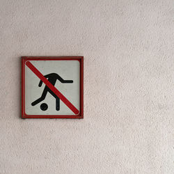 Close-up of warning sign on wall