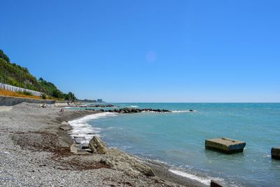 Scenic view of sea against clear blue sky