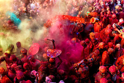 Hindu devotees play with colorful powders at the radharani temple of nandgaon during the festival. 