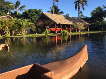 Scenic view of palm trees by lake