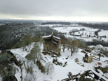 Snow covered landscape against sky