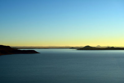 Scenic view of calm sea against clear sky