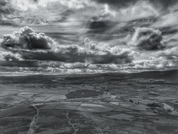 Scenic view of sea against cloudy sky