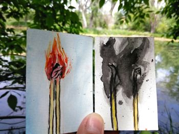 Close-up of hand holding plant