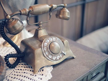 Close-up of telephone booth on table