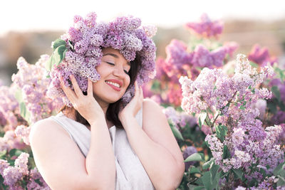 Portrait of young woman with flowers