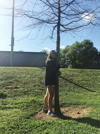 Full length of woman standing on field