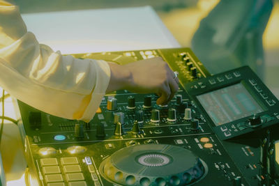 Cropped hand of businessman working on table