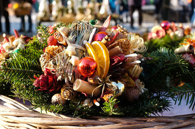 Close-up of christmas decorations in wicker basket