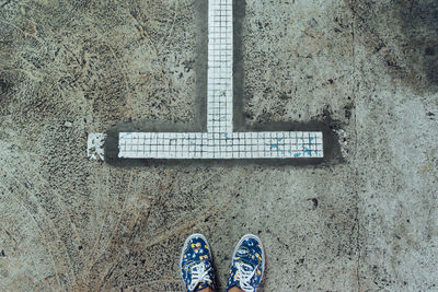 Low section of man standing on floor