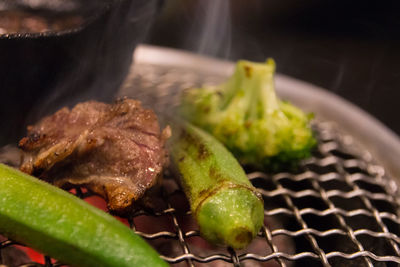 Close-up of meat on barbecue grill