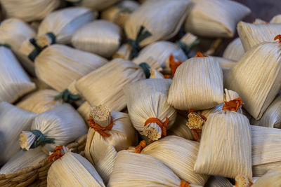Mexican tamales filed corn dough, spicy food or candy in mexico