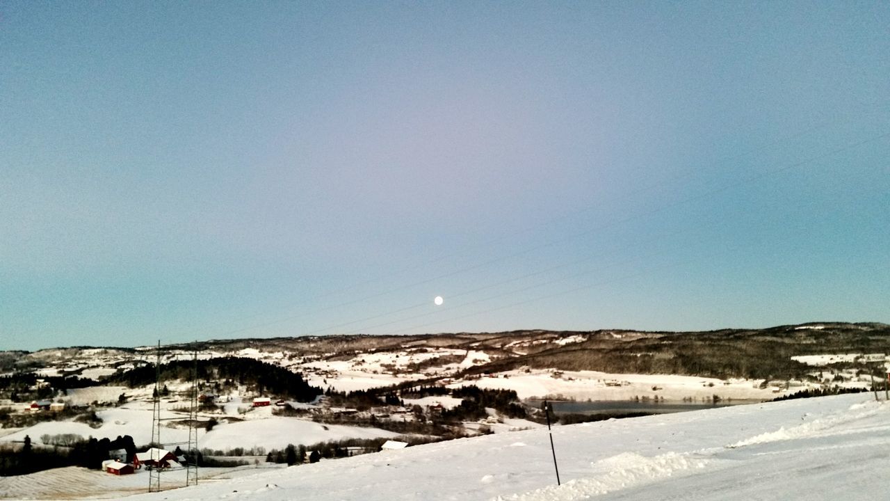 snow, winter, clear sky, cold temperature, copy space, tranquility, landscape, tranquil scene, scenics, blue, beauty in nature, nature, season, mountain, road, street light, non-urban scene, weather, sky, outdoors