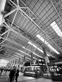 Low angle view of people at railroad station