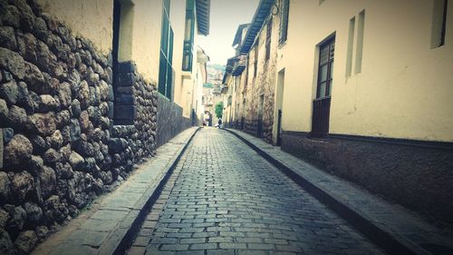 Narrow alley along buildings