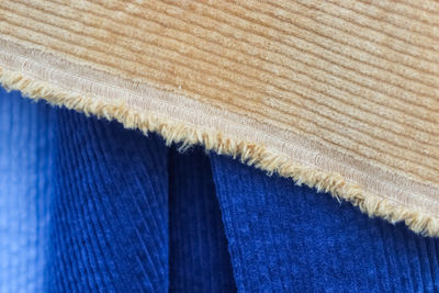 Detailed close up view on samples of cloth and fabrics in different colors found at a fabrics market