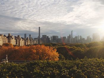 City skyline against cloudy sky