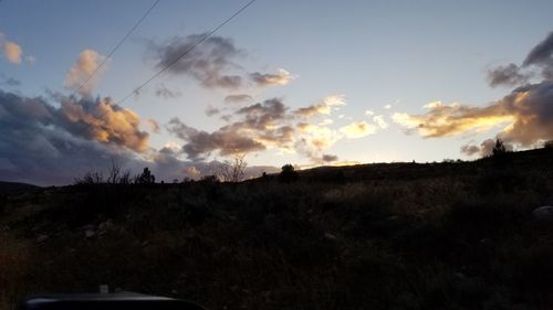 Scenic view of silhouette landscape against sky during sunset