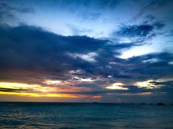 Scenic view of sea against dramatic sky