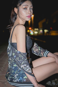 Close-up portrait of young woman standing outdoors