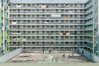 Group of people amidst residential building