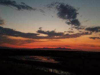 Scenic view of silhouette against sky during sunset