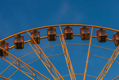 Part of a ferris wheel in sunset