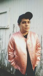 Portrait of young man standing outdoors