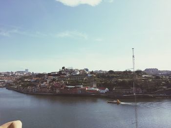 River in town against sky