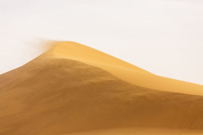 Scenic view of desert against clear sky