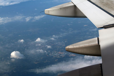 Aerial view of airplane flying in sky