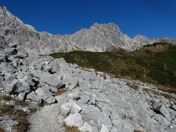 Scenic view of snowcapped mountains against clear blue sky