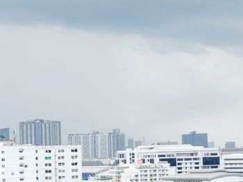 Buildings in city against sky