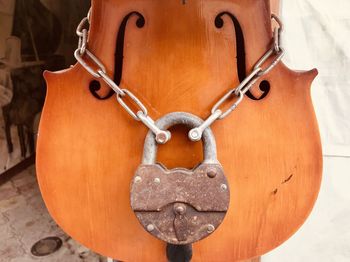 Close-up of heart shape hanging on wood