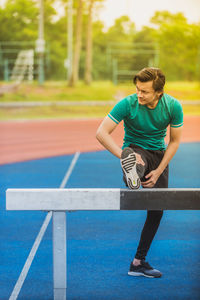 Young man exercising at stadium