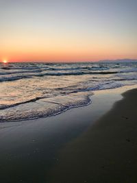 Scenic view of sea against clear sky during sunset