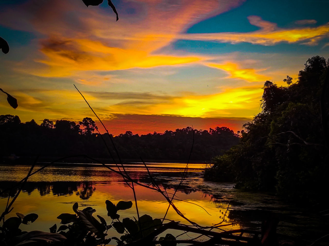 sky, sunset, water, beauty in nature, cloud, nature, evening, afterglow, scenics - nature, tranquility, plant, tree, reflection, tranquil scene, silhouette, dusk, orange color, no people, sunlight, sun, lake, environment, landscape, idyllic, outdoors, dramatic sky, land, non-urban scene, tropical climate, red sky at morning, travel destinations