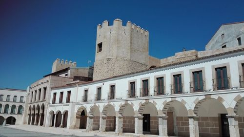 Low angle view of historical building against blue sky