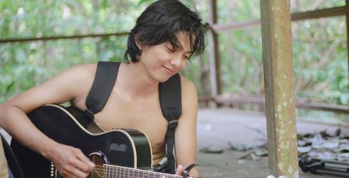 Young woman playing guitar