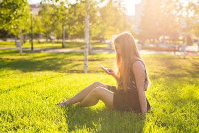 Woman sitting on field