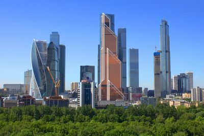 Modern buildings against sky in city