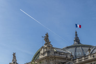 Low angle view of building against blue sky