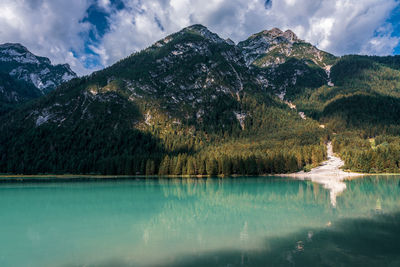 Panoramic view of lake dobbiaco in the dolomites, italy.