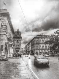 View of buildings against cloudy sky