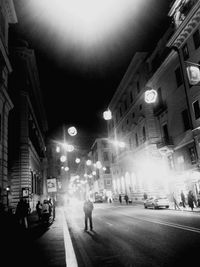 View of illuminated street at night