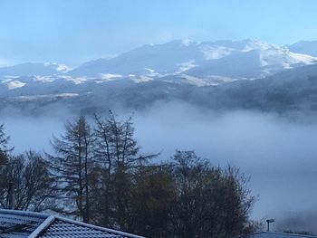 Scenic view of mountains against sky during winter